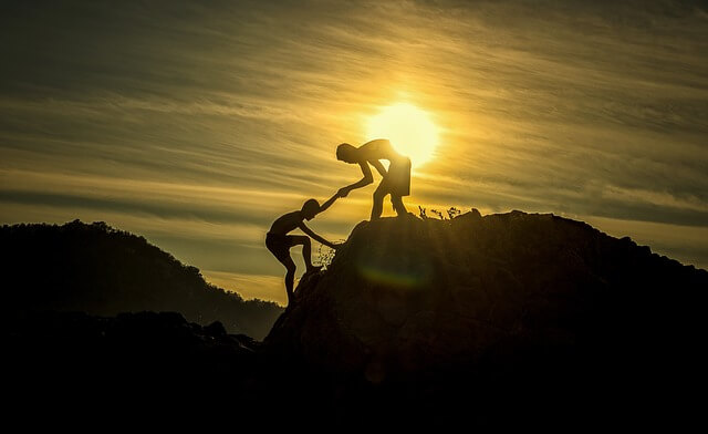 climbing a mountain with partner.