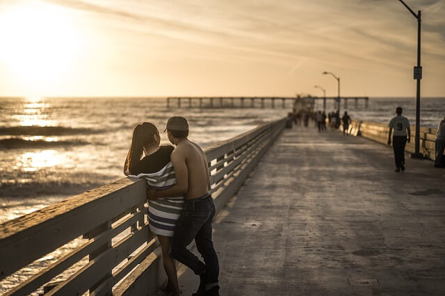 couple looking at a sunset.