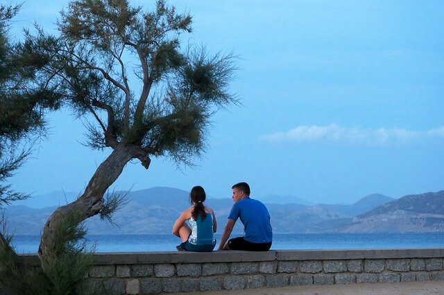 couple looking towards a sea view.