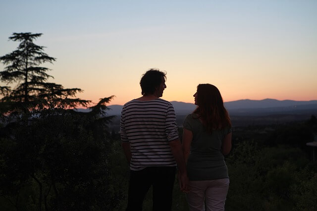 couple looking at a forest view