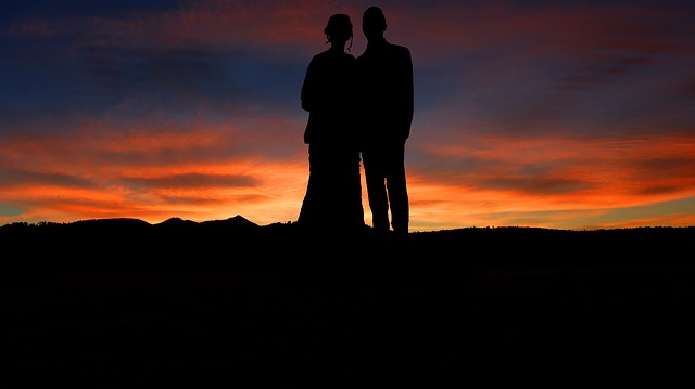 man and a woman in a sunset