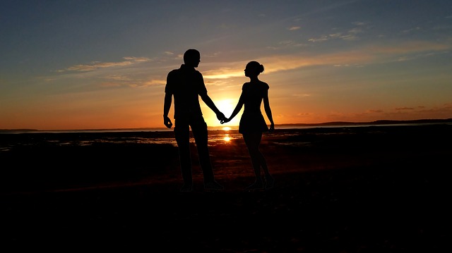 girlfriend and boyfriend holding hands.