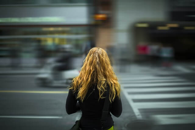 girl crossing a street.