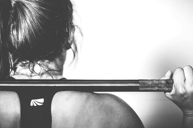 woman working out to become confident